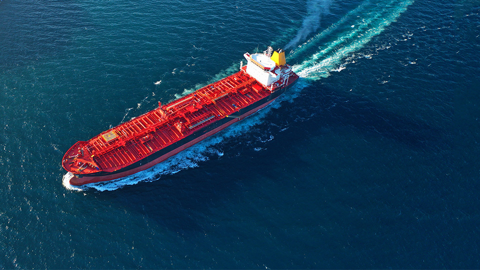 Aerial view of bright red tanker ship